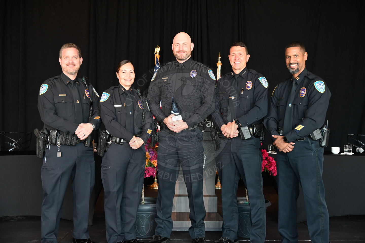 Police Officer of the year standing other police staff.