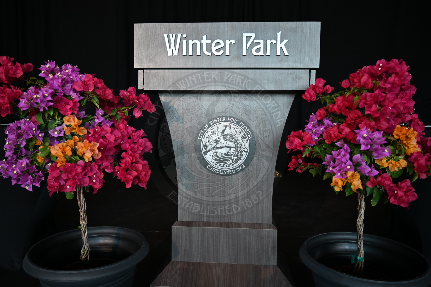 Winter Park Podium with colorful flowers on each side of the podium.