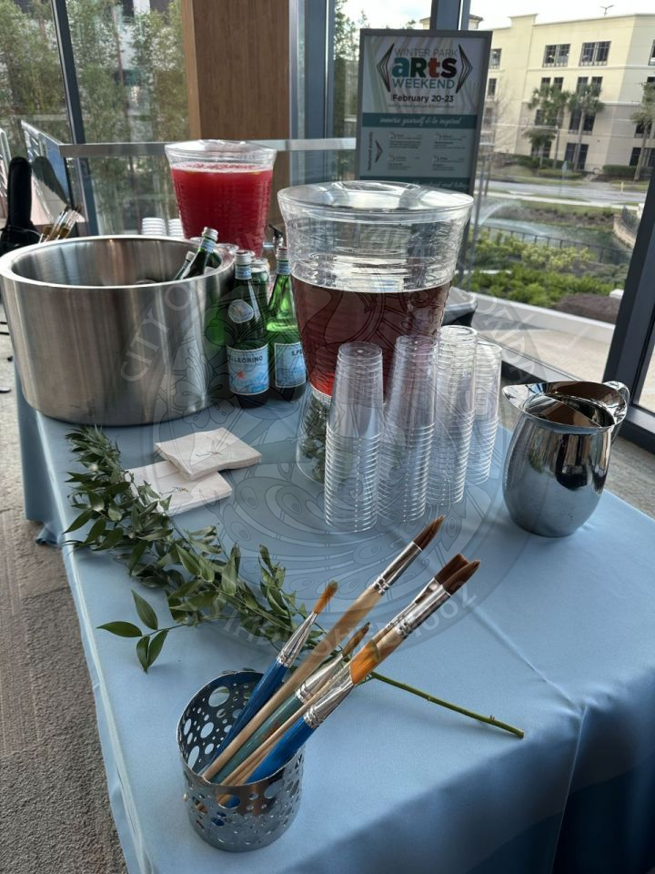 cups with a two punch bowls full of juice 