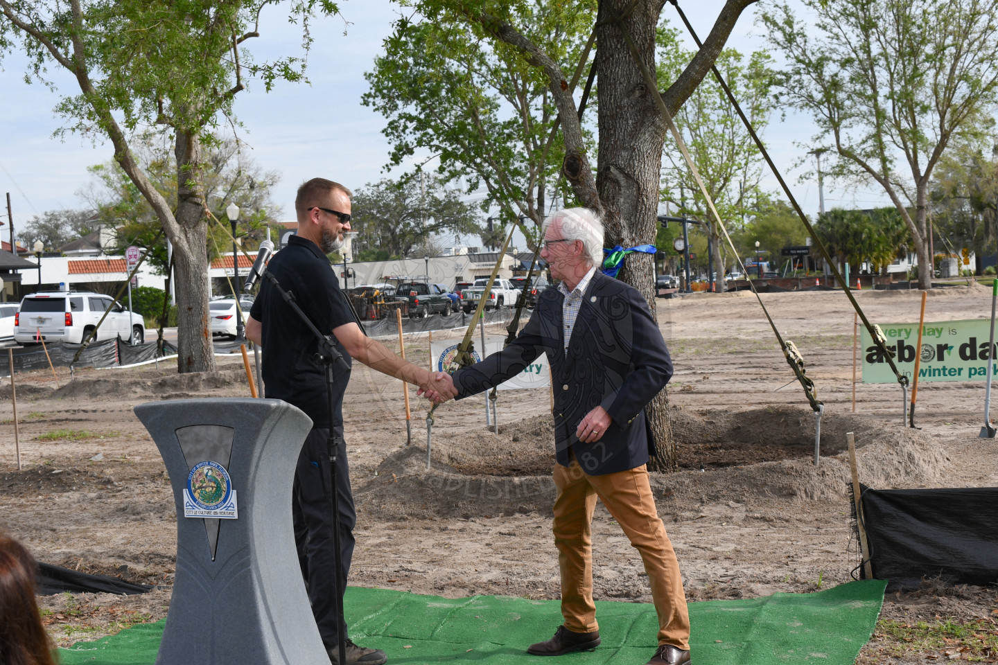 Mayor Phil Anderson and shaking city employee hand
