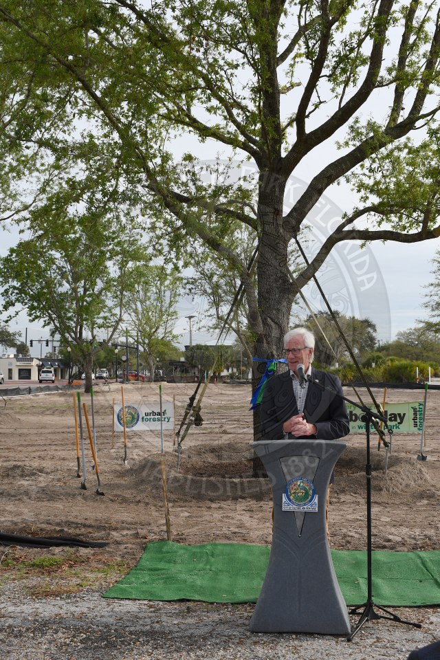 Mayor Phil Anderson standing behind podium talking into microphone