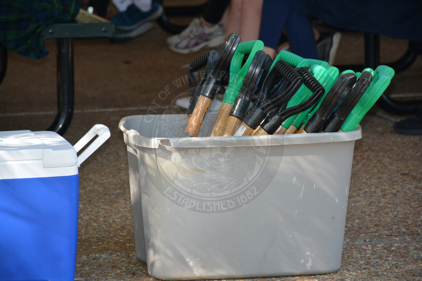 smaller shovels in a plastic bin