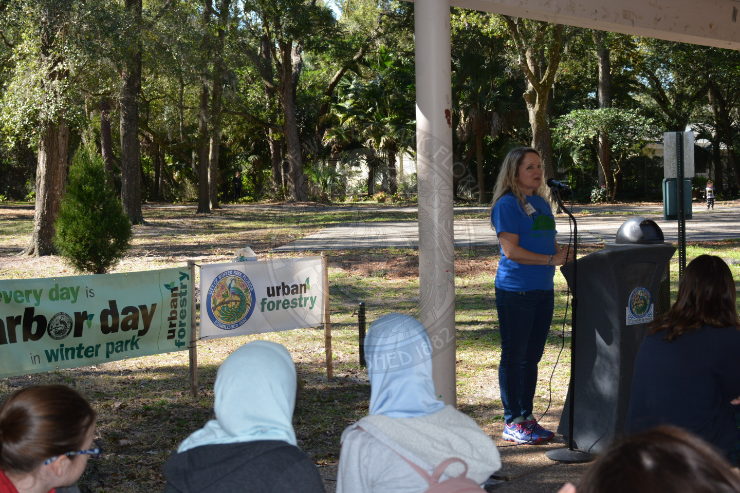 Female at the podium sharing remarks