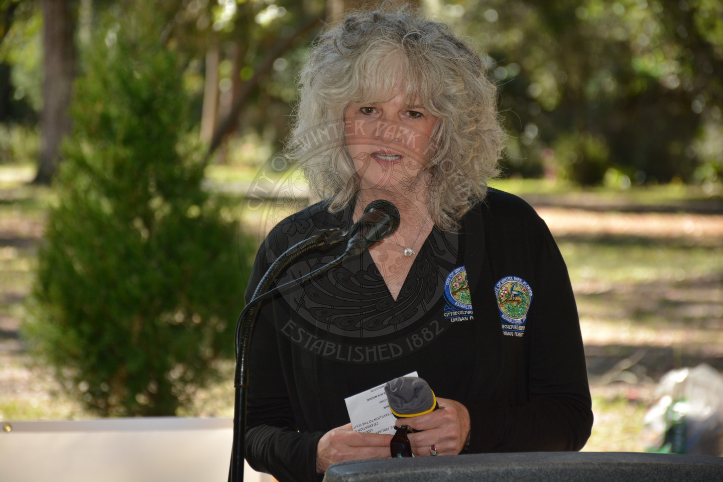Urban Forestry manager Dru Dennison speaking at the podium