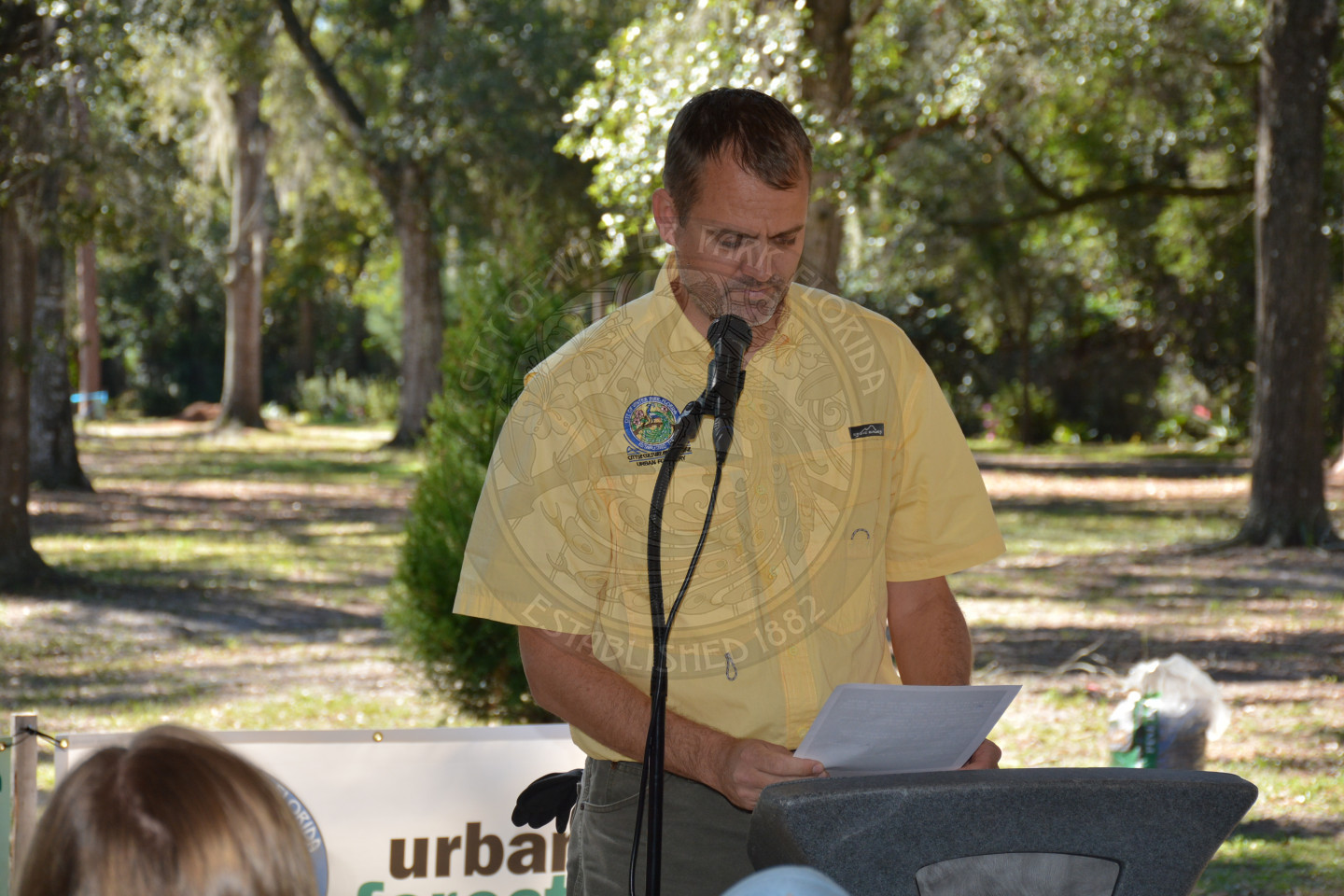 Urban Forestry staff speaking at the podium