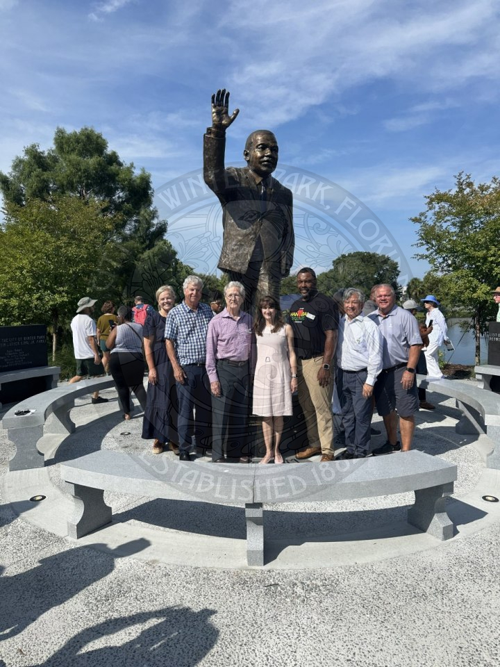 a group of people standing in front of the Martin Luther King Statue