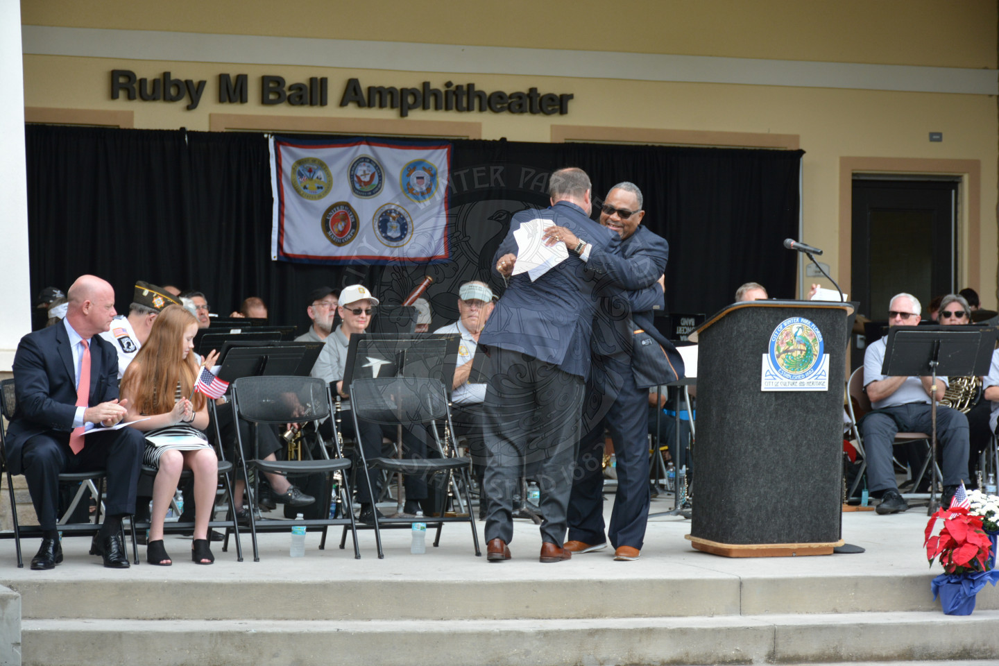 Mayor Leary gives the reverend a hug on stage