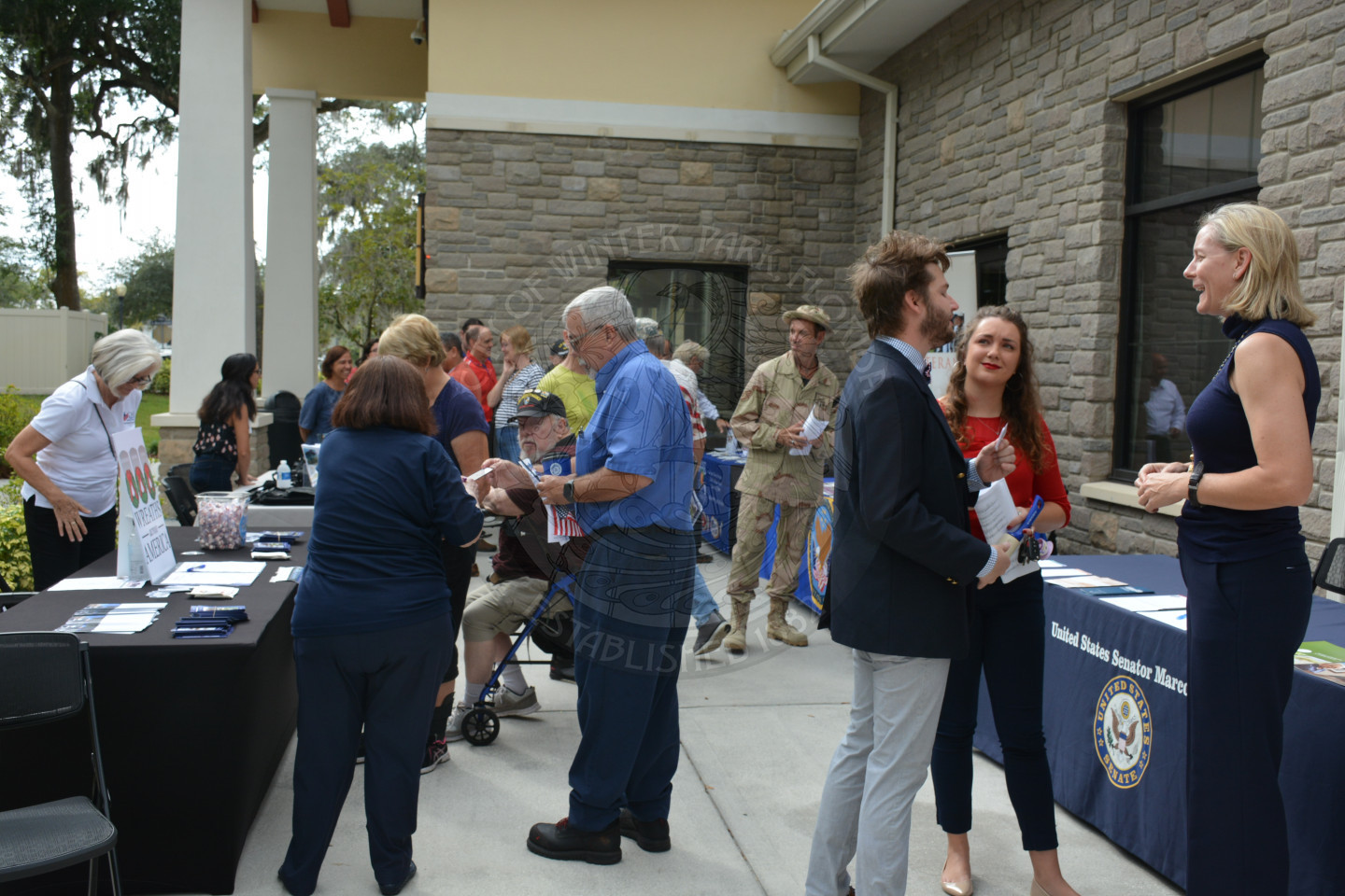 group of event attendees checking out the vendor booths