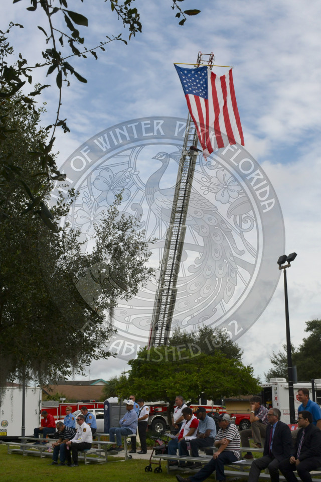 Fire Rescue department tiller truck waving American flag