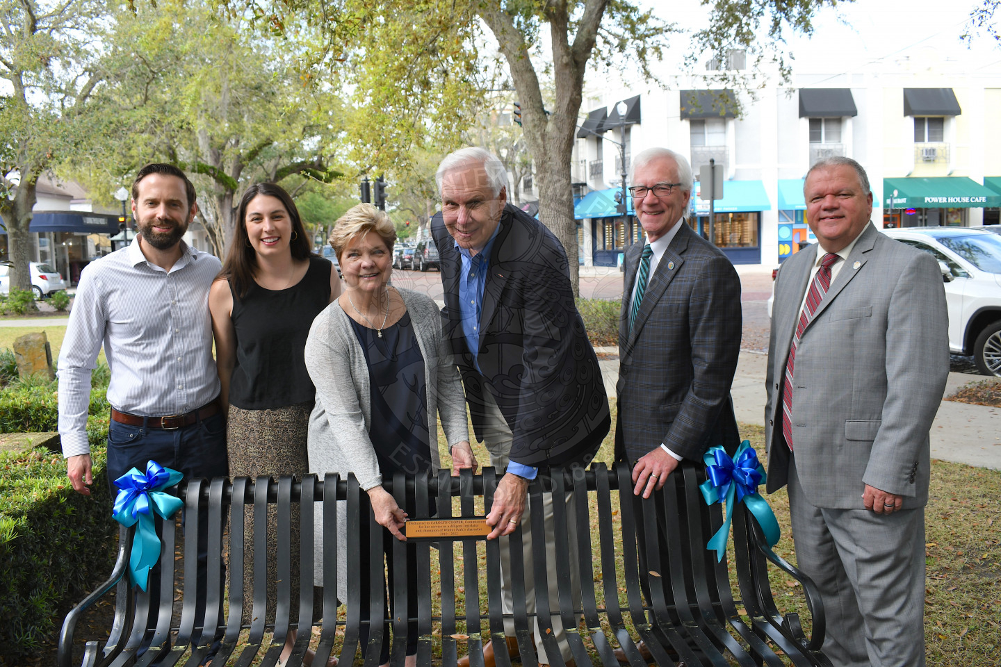 Commissioner Carolyn Cooper with husband, daughter, son-in-law, Mayor Phil Anderson and city manager Randy Knight