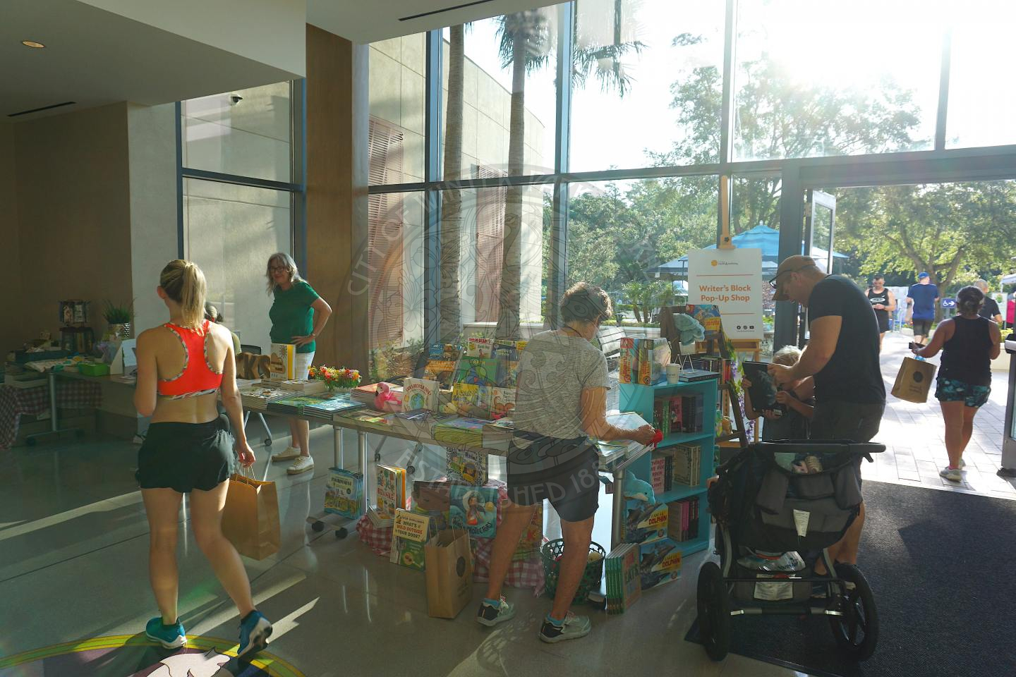 an L-shape table with a bunch of books on it