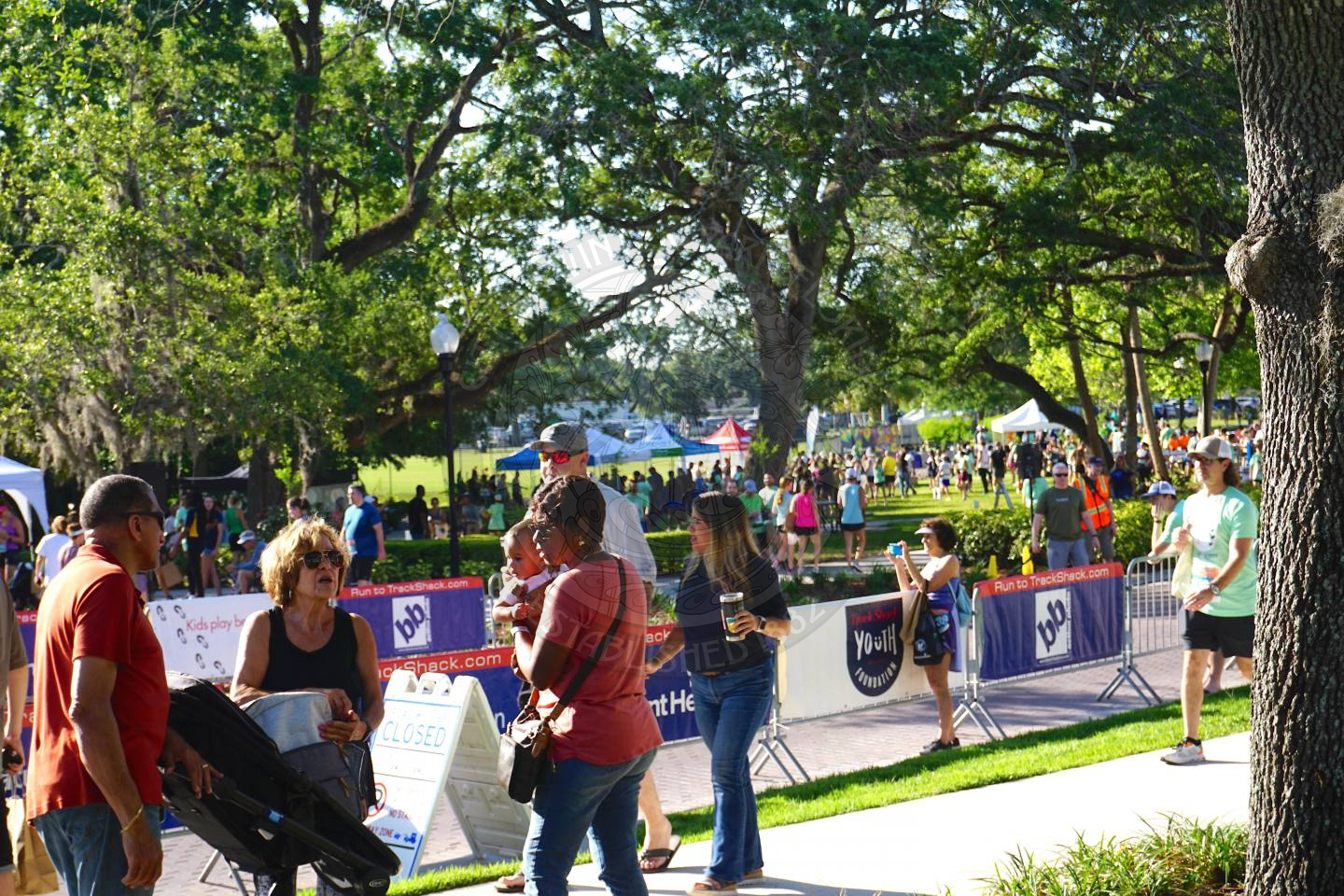 a shot of the peoeple walking and go to each tent at the event.