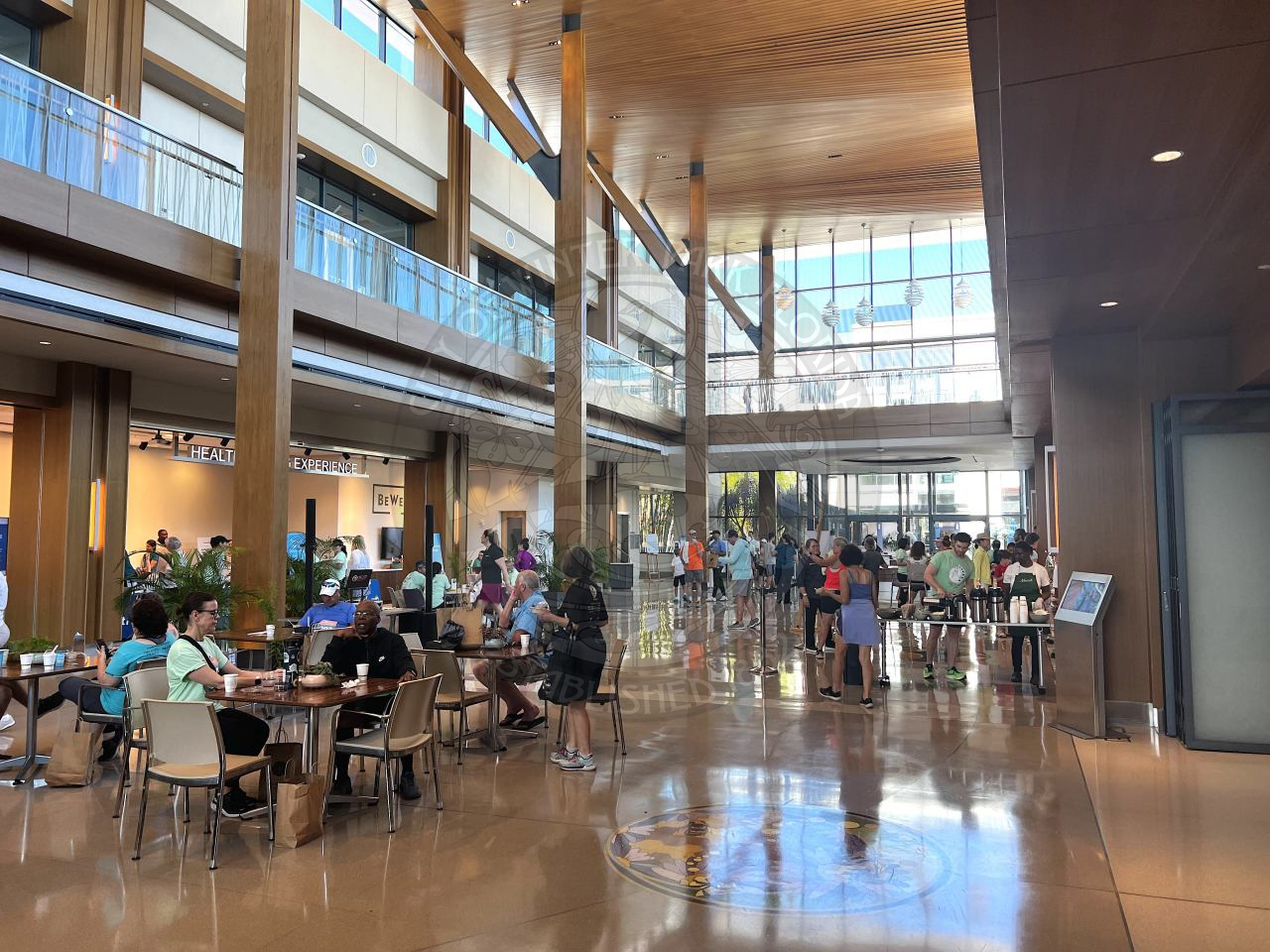 a bunch of people walking around the inside of Center for Health &amp; Wellbeing