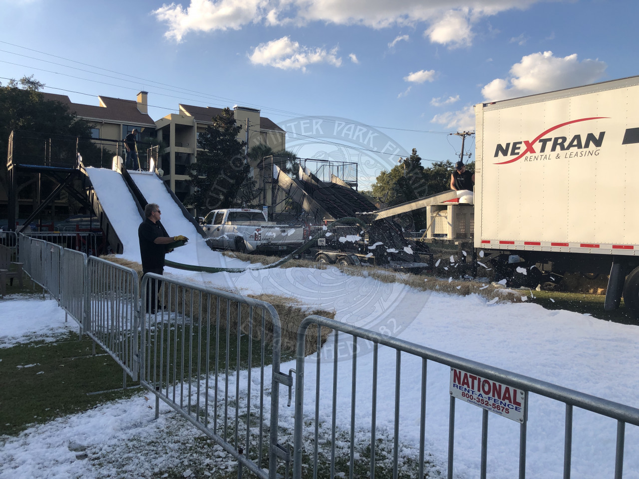 man blowing snow on the ground to create snow slides
