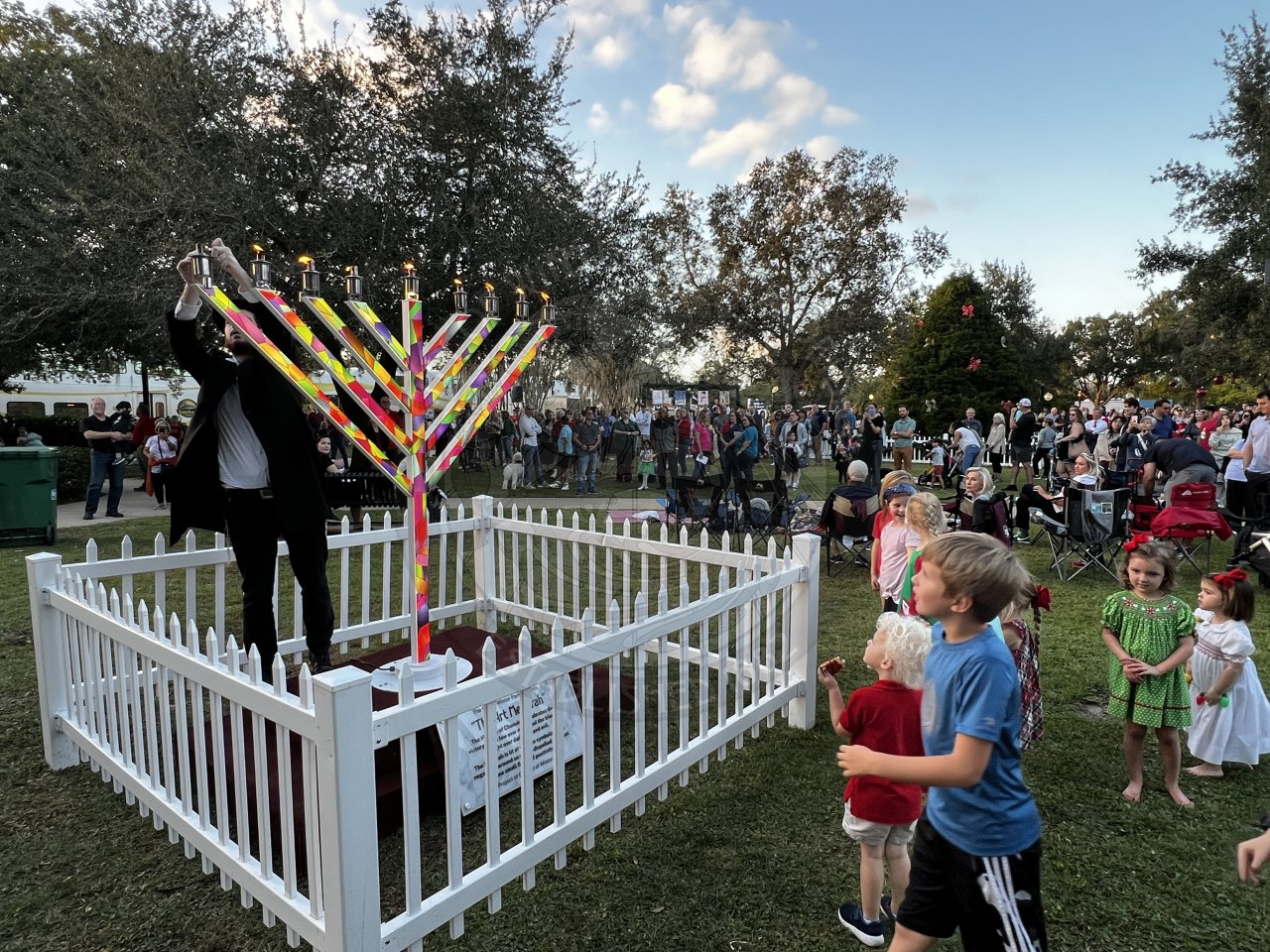 Man lighting the Menorah candles