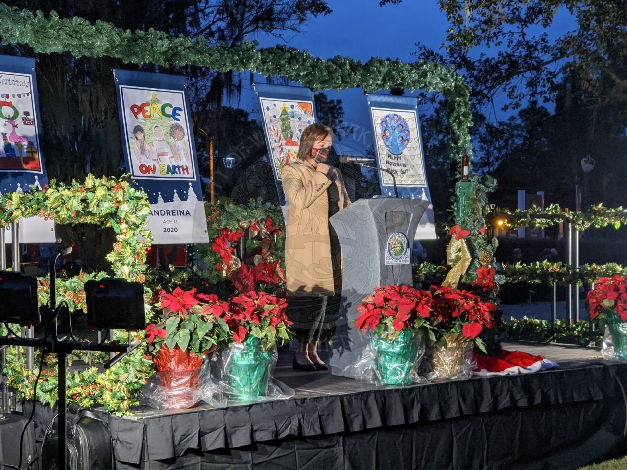Betsy Eckbert, president of the Chamber, on stage behind a podium