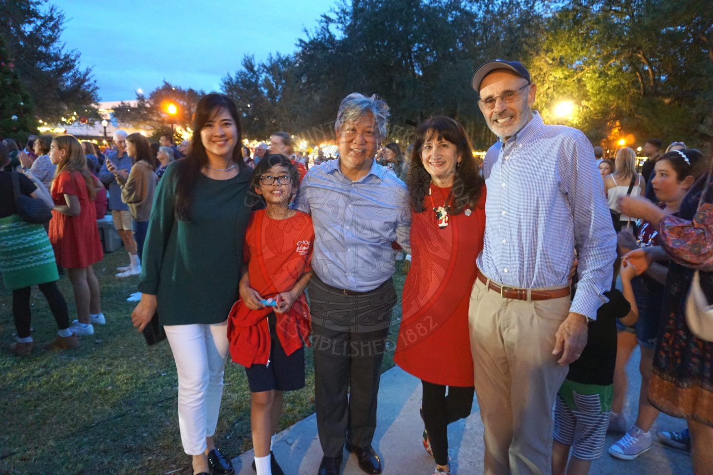 Commissioner Cruzada with his wife and son standing next to Commission DeCiccio with her husband.