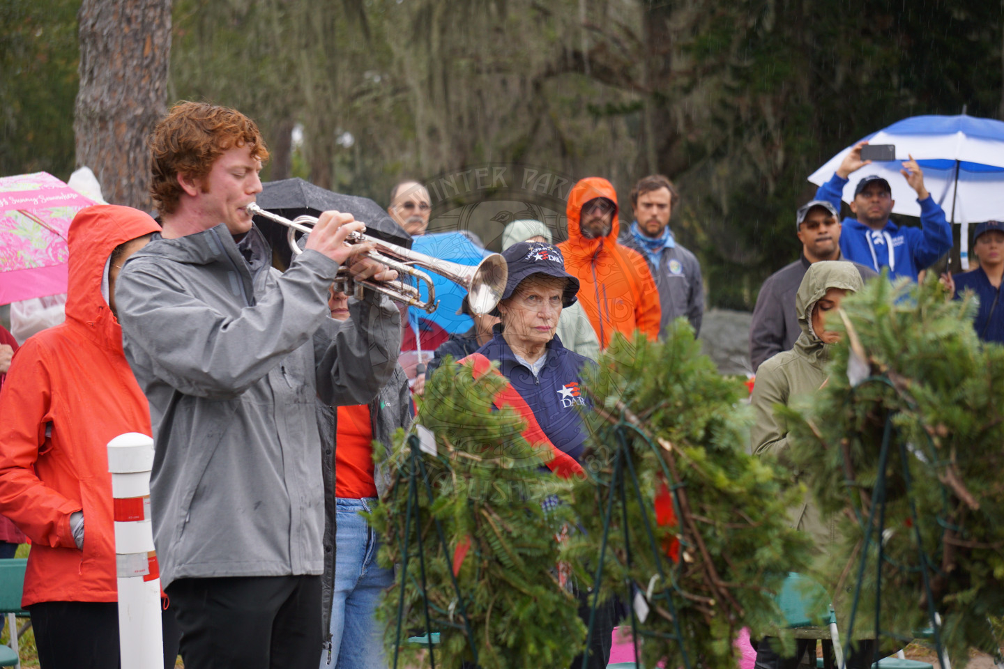 a boy playing taps on a trumpet.