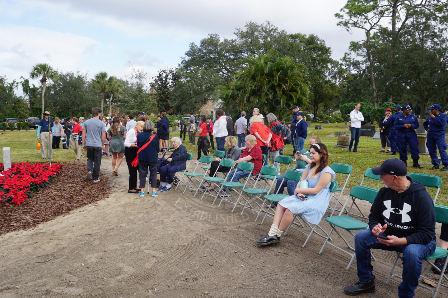 people gathered around waiting for a ceremony about to start. 