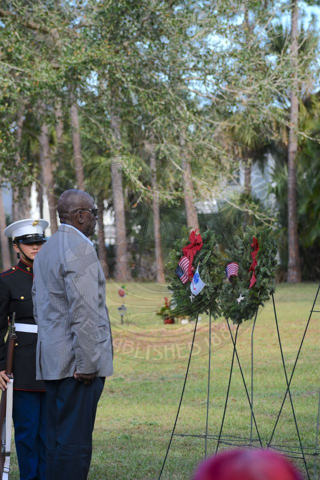Veteran saluting to wreath at Pineywood Cemetary