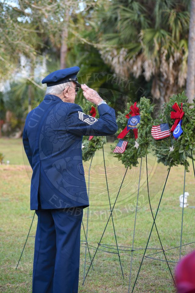 Veteran saluting to wreath at Pineywood Cemetary