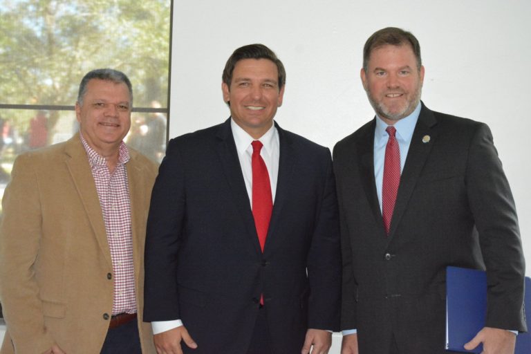 City of Winter Park City Manager, Randy Knight, 46th Governor of Florida, Ron DeSantis, City of Winter Park Mayor, Steve Leary posing for a photo