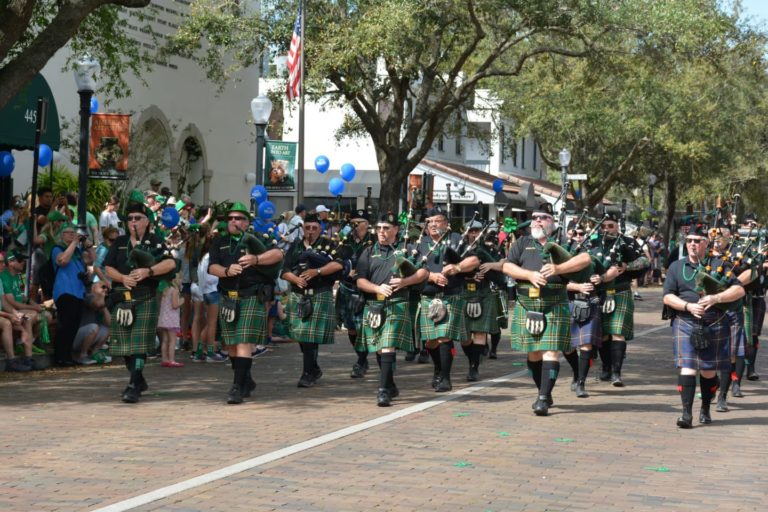 Men playing bagpipe in St. Patrick’s Day Parade down Park Avenue in Winter Park, FL