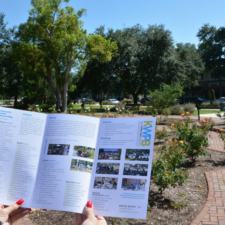 Community Partners brochure overlooking a rose garden and businesses