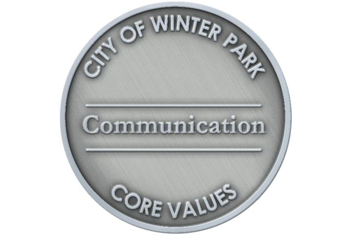 A coin representing the core value of Communication