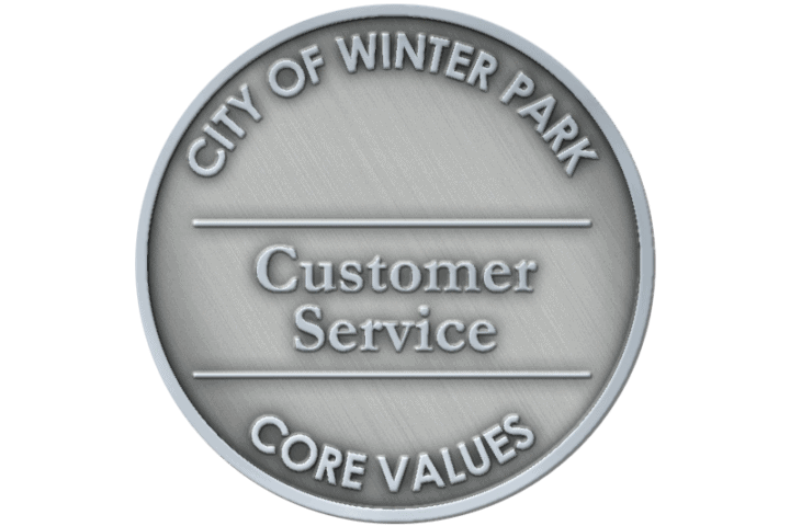A coin representing the core value of Customer Service