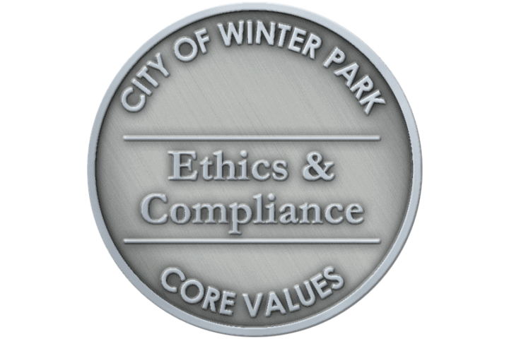A coin representing the core value of Ethics & Compliance