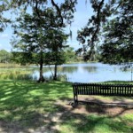 slatted bench facing large lake