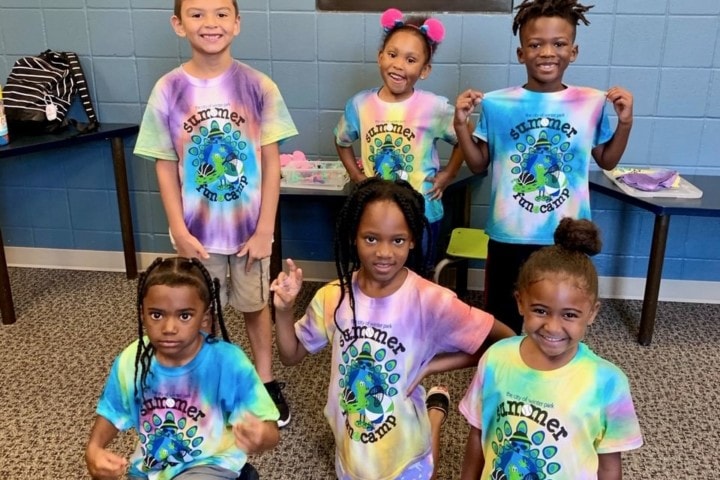 five young kids in tie-dyed shirts
