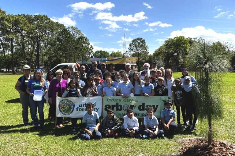 Group photo of kids and adults at Trees for Peace event