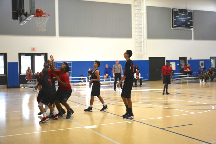 teenage boys playing basketball