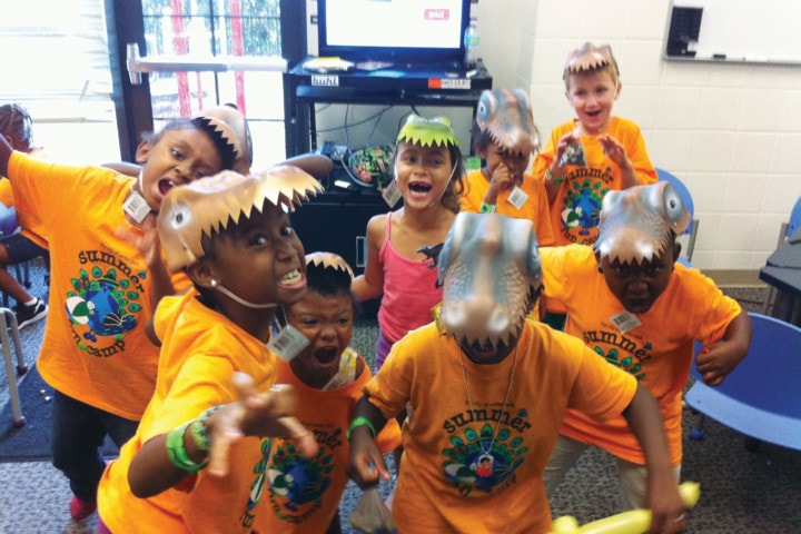 Kids with dinosaur masks on