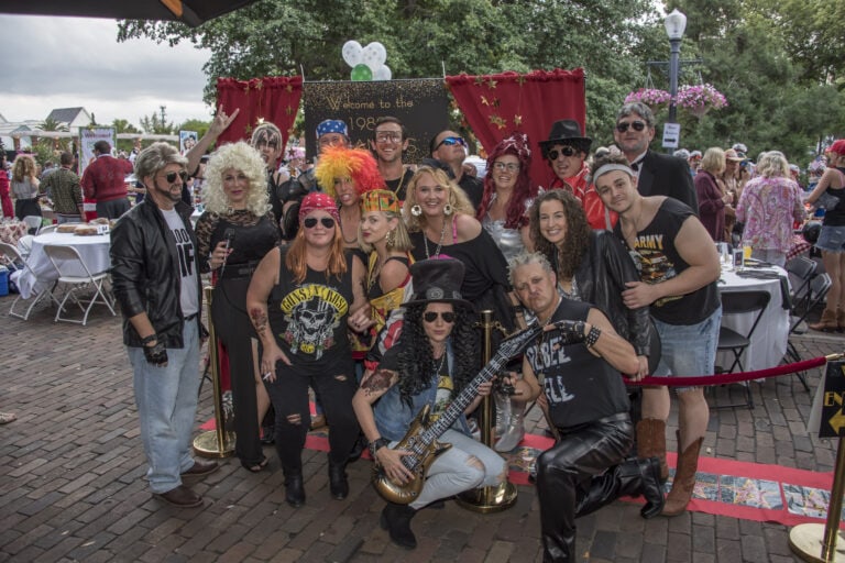 Group of people dressed in 1980s's Grammy themed clothing