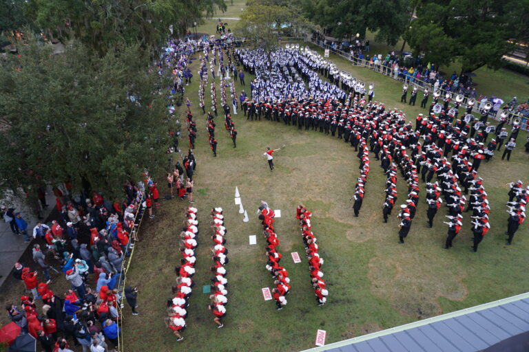 ariel view of Kansas State and North Carolina bands lined up ready to battle each other