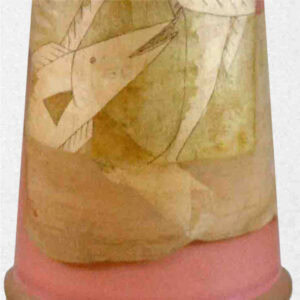 The body of the piece displays a light-colored fish pattern on a muted background, accented with a pink base and clear, wavy elements near the top.