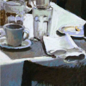 A table setting with a grey place mat, cup of coffee, cup of water, plate with food on it, and a newspaper at the ledge of the table.