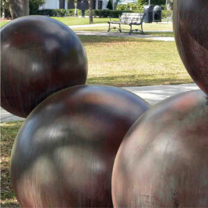 sculpture of a bunch of round balls (that are molecules) to be shaped as a dog.