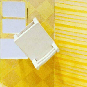 the op view of a white chair on a yellow wall.