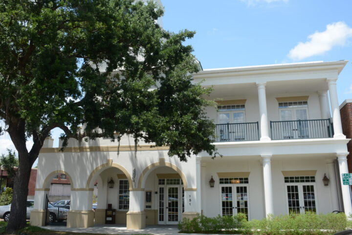 building with three arches, balcony and cupola