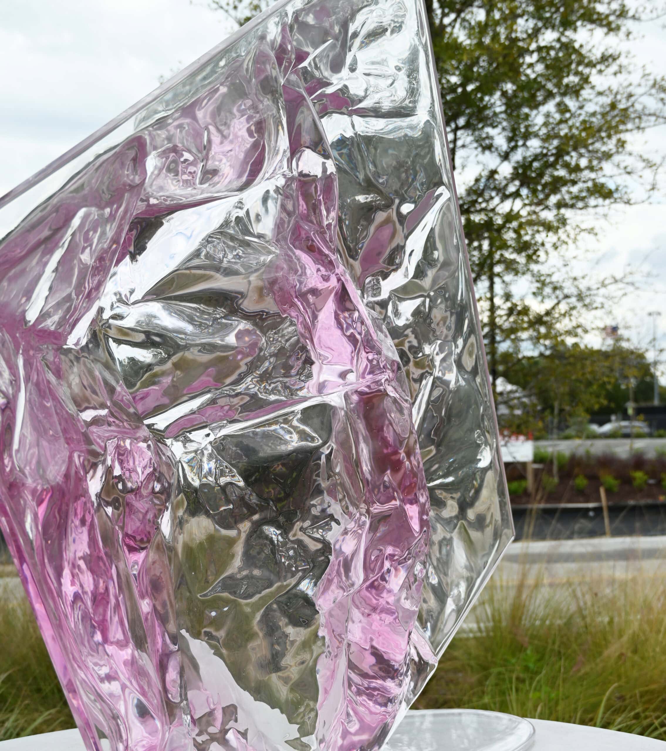 acrylic ssculpture that appears to be a melting piece of ice with color variations