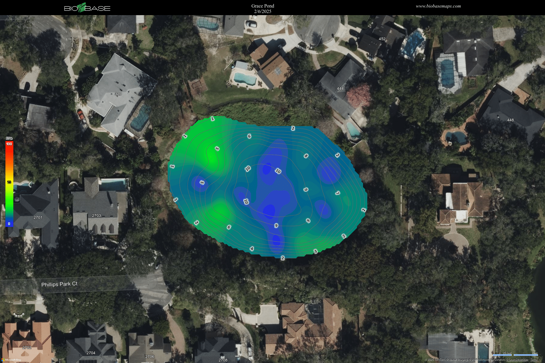 Aerial view of a pond with colored depth map overlay, surrounded by houses and trees.