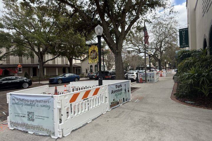 White barricades block part of the sidewalk during the Park Avenue Refresh Project.
